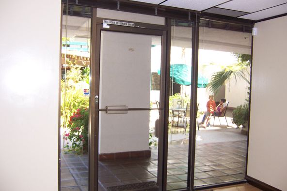 PRIVATE OFFICE WITH GLASS DOOR TO GAZEBO. Ground floor.